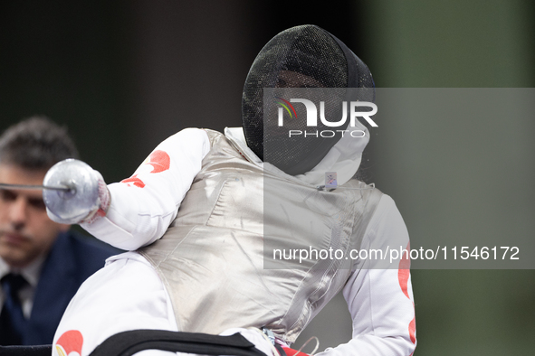 Rong Xiao of China and Beatrice Maria ''Bebe'' Vio Grandis of Italy compete during the Women's Foil Category B Semifinal at Gran Palais duri...