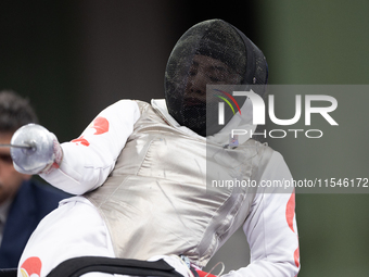 Rong Xiao of China and Beatrice Maria ''Bebe'' Vio Grandis of Italy compete during the Women's Foil Category B Semifinal at Gran Palais duri...