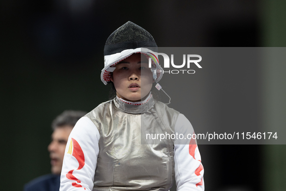 Rong Xiao of China and Beatrice Maria ''Bebe'' Vio Grandis of Italy compete during the Women's Foil Category B Semifinal at Gran Palais duri...