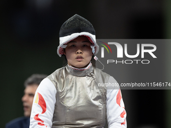 Rong Xiao of China and Beatrice Maria ''Bebe'' Vio Grandis of Italy compete during the Women's Foil Category B Semifinal at Gran Palais duri...