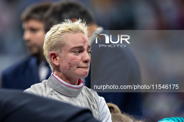 Beatrice Maria ''Bebe'' Vio Grandis of Italy reacts after she loses against Rong Xiao of China during the Women's Foil Category B Semifinal...