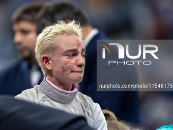 Beatrice Maria ''Bebe'' Vio Grandis of Italy reacts after she loses against Rong Xiao of China during the Women's Foil Category B Semifinal...