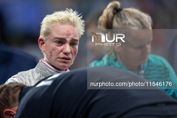 Beatrice Maria ''Bebe'' Vio Grandis of Italy reacts after she loses against Rong Xiao of China during the Women's Foil Category B Semifinal...