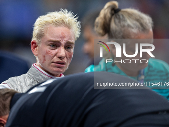 Beatrice Maria ''Bebe'' Vio Grandis of Italy reacts after she loses against Rong Xiao of China during the Women's Foil Category B Semifinal...