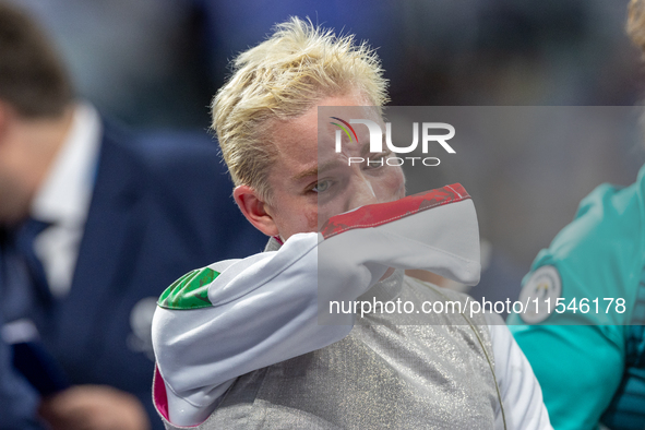 Beatrice Maria ''Bebe'' Vio Grandis of Italy reacts after she loses against Rong Xiao of China during the Women's Foil Category B Semifinal...