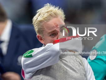 Beatrice Maria ''Bebe'' Vio Grandis of Italy reacts after she loses against Rong Xiao of China during the Women's Foil Category B Semifinal...