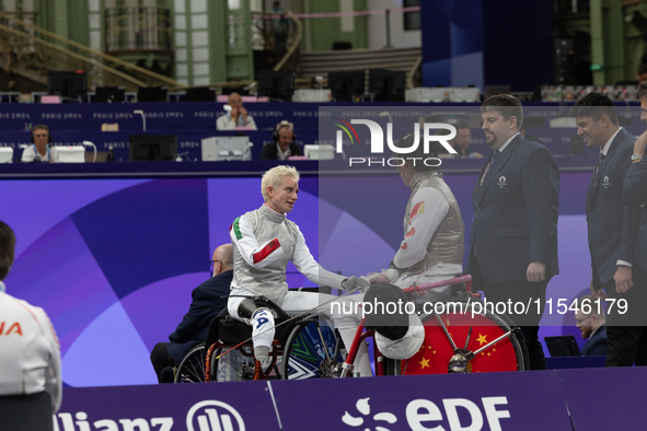 Beatrice Maria ''Bebe'' Vio Grandis of Italy competes against Rong Xiao of China during the Women's Foil Category B Semifinal at Gran Palais...