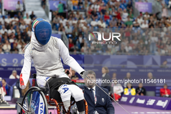 Beatrice Maria ''Bebe'' Vio Grandis of Italy competes against Rong Xiao of China during the Women's Foil Category B Semifinal at Gran Palais...