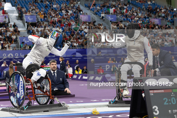 Beatrice Maria ''Bebe'' Vio Grandis of Italy competes against Rong Xiao of China during the Women's Foil Category B Semifinal at Gran Palais...