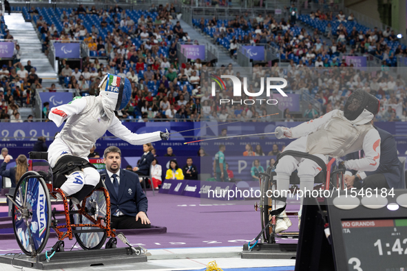 Beatrice Maria ''Bebe'' Vio Grandis of Italy competes against Rong Xiao of China during the Women's Foil Category B Semifinal at Gran Palais...