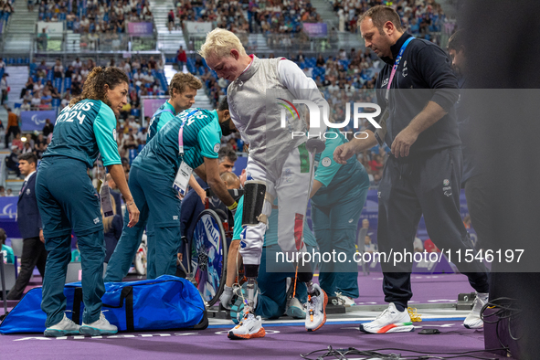 Beatrice Maria ''Bebe'' Vio Grandis of Italy reacts after she loses against Rong Xiao of China during the Women's Foil Category B Semifinal...