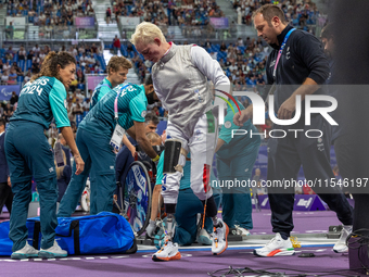 Beatrice Maria ''Bebe'' Vio Grandis of Italy reacts after she loses against Rong Xiao of China during the Women's Foil Category B Semifinal...