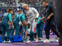 Beatrice Maria ''Bebe'' Vio Grandis of Italy reacts after she loses against Rong Xiao of China during the Women's Foil Category B Semifinal...