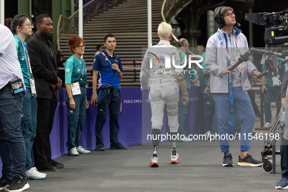 Beatrice Maria ''Bebe'' Vio Grandis of Italy reacts after she loses against Rong Xiao of China during the Women's Foil Category B Semifinal...