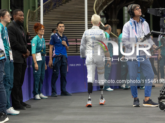 Beatrice Maria ''Bebe'' Vio Grandis of Italy reacts after she loses against Rong Xiao of China during the Women's Foil Category B Semifinal...