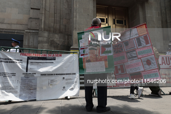 A group of people demonstrates outside the Supreme Court of Justice of the Nation in Mexico City, Mexico, on September 4, 2024, where they h...