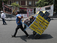 A merchant carries his products outside the Supreme Court of Justice of the Nation in Mexico City, Mexico, on September 4, 2024, where a wor...