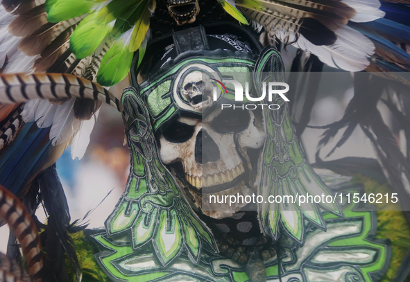 A pre-Hispanic dancer stands outside the Supreme Court of Justice of the Nation in Mexico City, Mexico, on September 4, 2024, where a work s...