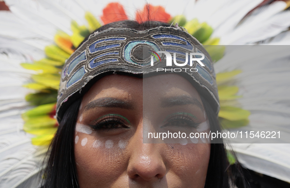 A pre-Hispanic dancer stands outside the Supreme Court of Justice of the Nation in Mexico City, Mexico, on September 4, 2024, where a work s...