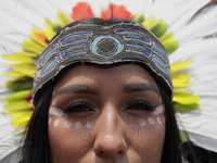 A pre-Hispanic dancer stands outside the Supreme Court of Justice of the Nation in Mexico City, Mexico, on September 4, 2024, where a work s...