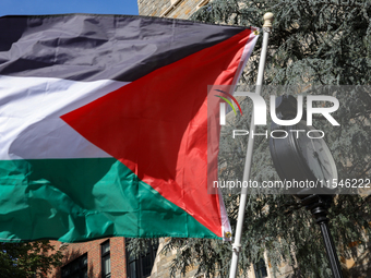 A Palestinian flag waves near a clock in Georgetown University's Red Square in Washington, D.C. durung a pro-Palestine demonstration on Sept...