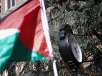 A Palestinian flag waves near a clock in Georgetown University's Red Square in Washington, D.C. durung a pro-Palestine demonstration on Sept...