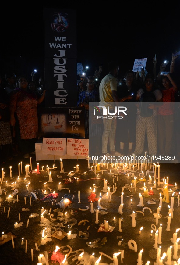 People participate in a protest to condemn the brutal rape and murder of a trainee doctor at RG Kar Medical College and Hospital in Kolkata,...