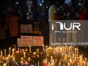 People participate in a protest to condemn the brutal rape and murder of a trainee doctor at RG Kar Medical College and Hospital in Kolkata,...