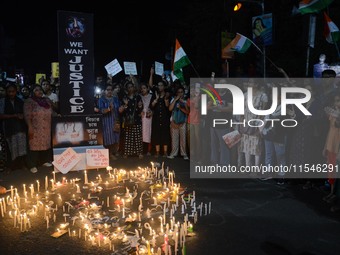 People participate in a protest to condemn the brutal rape and murder of a trainee doctor at RG Kar Medical College and Hospital in Kolkata,...