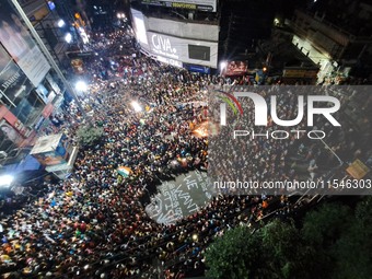 People participate in a protest to condemn the brutal rape and murder of a trainee doctor at RG Kar Medical College and Hospital in Kolkata,...