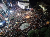 People participate in a protest to condemn the brutal rape and murder of a trainee doctor at RG Kar Medical College and Hospital in Kolkata,...