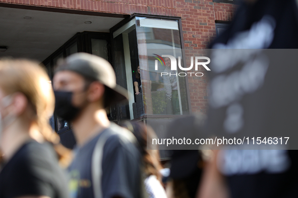 Students watch from windows as pro-Palestine demonstrators protest at Georgetown University in Washington, D.C. on September 4, 2024. 