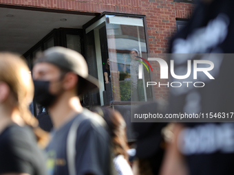 Students watch from windows as pro-Palestine demonstrators protest at Georgetown University in Washington, D.C. on September 4, 2024. (