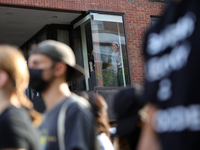 Students watch from windows as pro-Palestine demonstrators protest at Georgetown University in Washington, D.C. on September 4, 2024. (