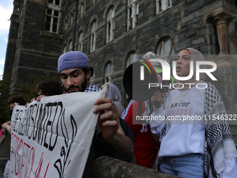 Pro-Palestine demonstrators protest on the steps of Healy Hall at Georgetown University in Washington, D.C. on September 4, 2024. (