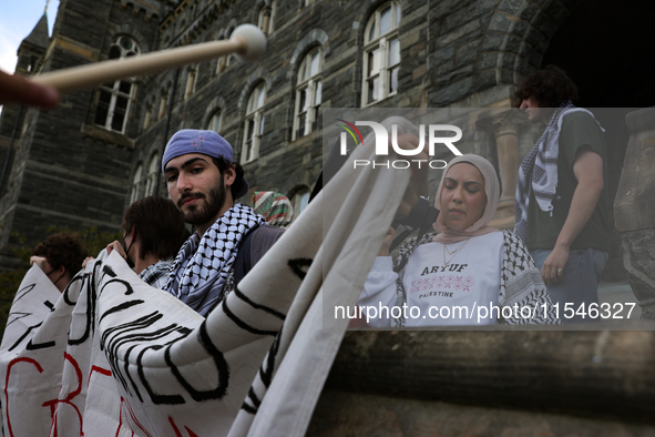 Pro-Palestine demonstrators protest on the steps of Healy Hall at Georgetown University in Washington, D.C. on September 4, 2024. 