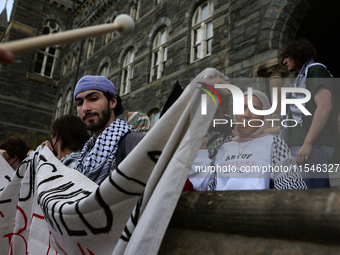 Pro-Palestine demonstrators protest on the steps of Healy Hall at Georgetown University in Washington, D.C. on September 4, 2024. (