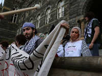 Pro-Palestine demonstrators protest on the steps of Healy Hall at Georgetown University in Washington, D.C. on September 4, 2024. (