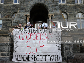 Pro-Palestine demonstrators protest on the steps of Healy Hall at Georgetown University in Washington, D.C. on September 4, 2024. (