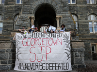 Pro-Palestine demonstrators protest on the steps of Healy Hall at Georgetown University in Washington, D.C. on September 4, 2024. (