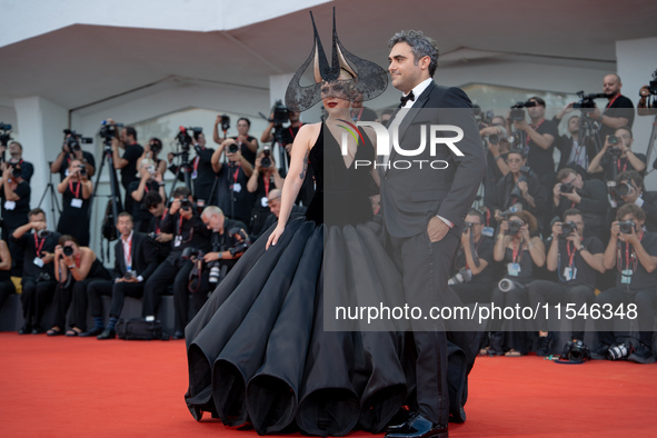 Lady Gaga and Michael Polansky attend the ''Joker: Folie a Deux'' red carpet during the 81st Venice International Film Festival at Sala Gran...