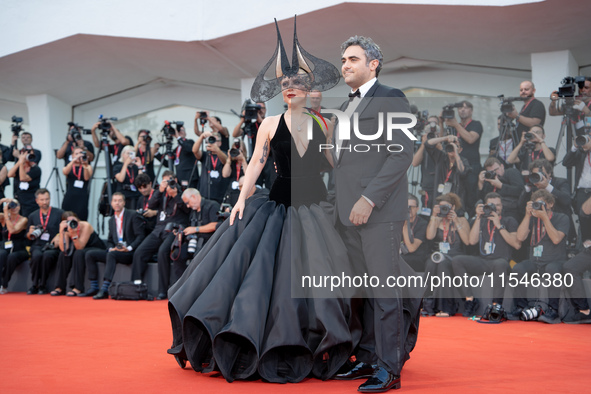 Lady Gaga and Michael Polansky attend the ''Joker: Folie a Deux'' red carpet during the 81st Venice International Film Festival at Sala Gran...