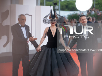 Venice Film Festival Director Alberto Barbera, Lady Gaga, and Biennale President Pietrangelo Buttafuoco attend the ''Joker: Folie a Deux'' r...