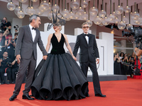 Joaquin Phoenix, Lady Gaga, and Director Todd Phillips attend the ''Joker: Folie a Deux'' red carpet during the 81st Venice International Fi...