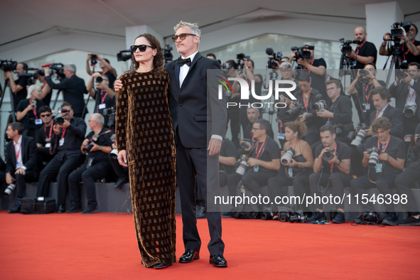 Joaquin Phoenix and Rain Phoenix attend the ''Joker: Folie a Deux'' red carpet during the 81st Venice International Film Festival at Sala Gr...