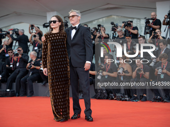 Joaquin Phoenix and Rain Phoenix attend the ''Joker: Folie a Deux'' red carpet during the 81st Venice International Film Festival at Sala Gr...