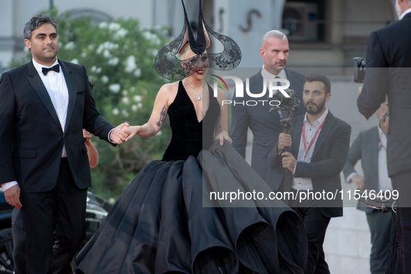 Lady Gaga and Michael Polansky attend the ''Joker: Folie a Deux'' red carpet during the 81st Venice International Film Festival at Sala Gran...