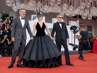 Joaquin Phoenix, Lady Gaga, and Director Todd Phillips attend the ''Joker: Folie a Deux'' red carpet during the 81st Venice International Fi...