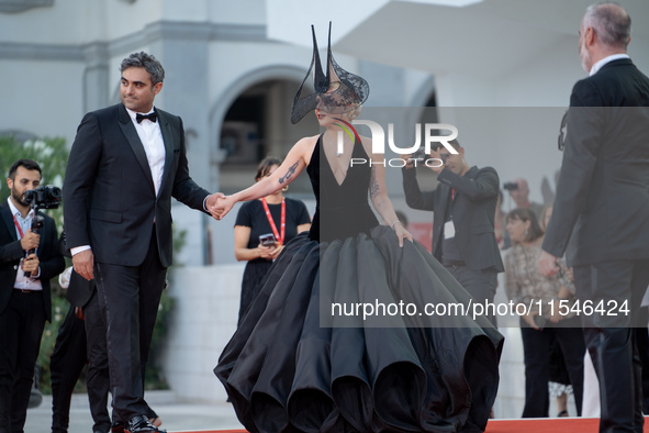 Lady Gaga and Michael Polansky attend the ''Joker: Folie a Deux'' red carpet during the 81st Venice International Film Festival at Sala Gran...