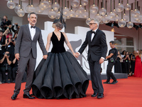 Joaquin Phoenix, Lady Gaga, and Director Todd Phillips attend the ''Joker: Folie a Deux'' red carpet during the 81st Venice International Fi...